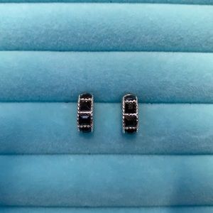 2 pairs of earrings - black and silver hoop earrings and black and gold studs